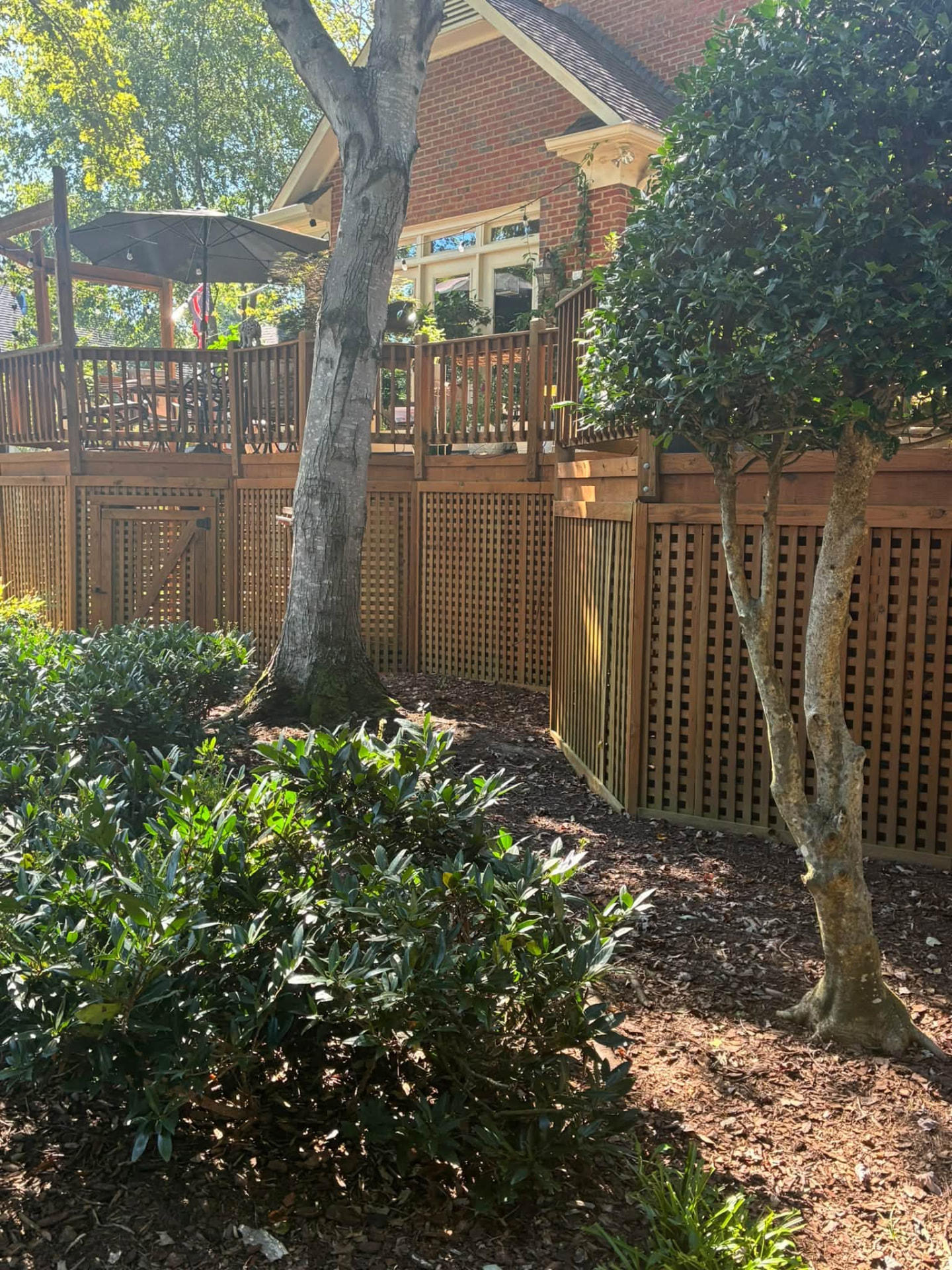 Under-deck lattice screens stained edge to edge