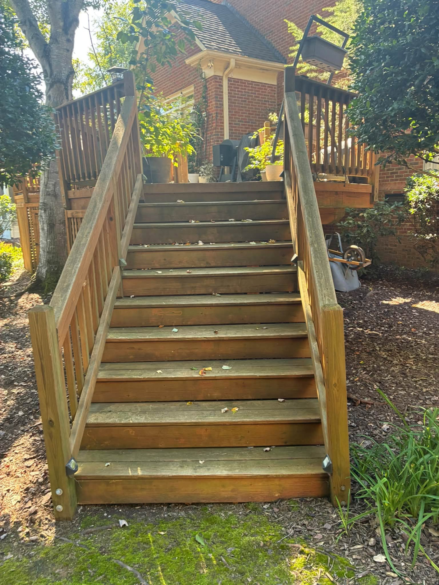 Before: Deck stairs and railings — pressure washed, then stained. Same stairs, same day.